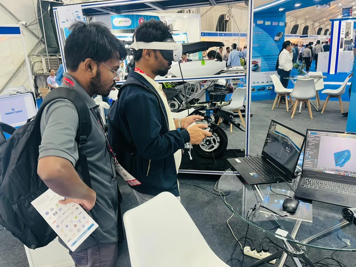 Visitor trying the Vrelab-developed product at the CAPCP exhibition stall